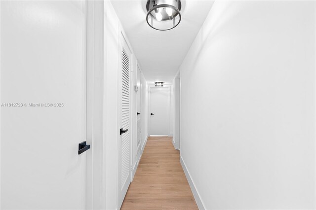 18801 NW 29th Ct, Miami Gardens, FL 33056 - corridor featuring light wood-style flooring and baseboards