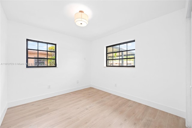 18801 NW 29th Ct, Miami Gardens, FL 33056 - spare room with plenty of natural light, light wood-style floors, and baseboards