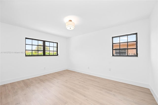 18801 NW 29th Ct, Miami Gardens, FL 33056 - unfurnished room with light wood-style flooring and baseboards
