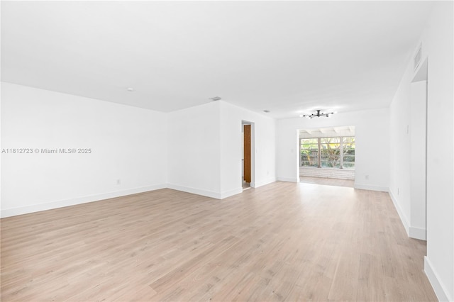 18801 NW 29th Ct, Miami Gardens, FL 33056 - spare room featuring light wood finished floors and baseboards