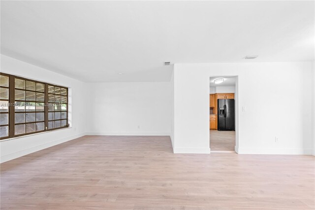 18801 NW 29th Ct, Miami Gardens, FL 33056 - spare room with light wood-style floors and baseboards