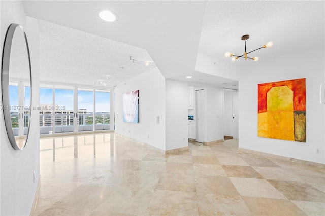 21055 Yacht Club Dr Unit 2104, Aventura, FL 33180 - spare room featuring a chandelier, baseboards, floor to ceiling windows, and recessed lighting