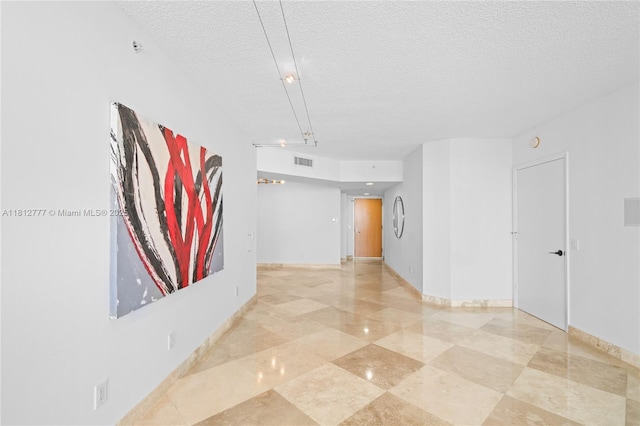 21055 Yacht Club Dr Unit 2104, Aventura, FL 33180 - hallway featuring a textured ceiling