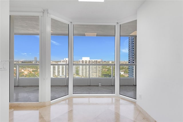 21055 Yacht Club Dr Unit 2104, Aventura, FL 33180 - unfurnished room with healthy amount of natural light, a view of city, and baseboards