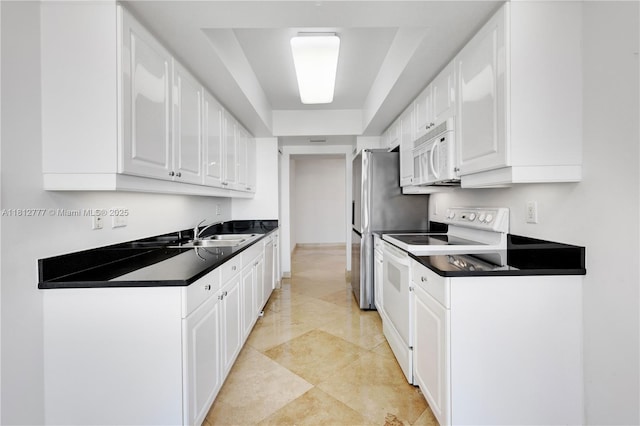 21055 Yacht Club Dr Unit 2104, Aventura, FL 33180 - kitchen featuring white appliances, a sink, white cabinetry, and dark countertops