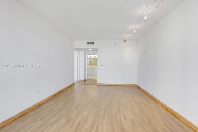 21055 Yacht Club Dr Unit 2104, Aventura, FL 33180 - spare room with light wood-type flooring and baseboards