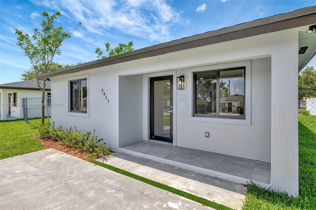 2411 NW 153rd St, Miami Gardens, FL 33054 - view of exterior entry featuring a patio