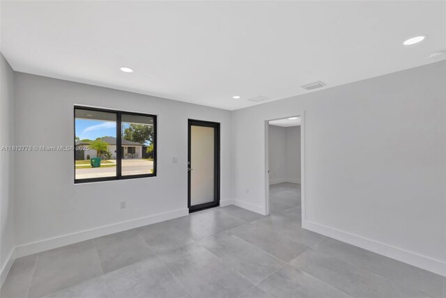 2411 NW 153rd St, Miami Gardens, FL 33054 - spare room with baseboards and recessed lighting