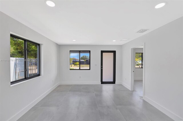 2411 NW 153rd St, Miami Gardens, FL 33054 - spare room with plenty of natural light, baseboards, and recessed lighting