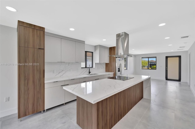 2411 NW 153rd St, Miami Gardens, FL 33054 - kitchen featuring island exhaust hood, black electric stovetop, stainless steel fridge with ice dispenser, a center island, and modern cabinets
