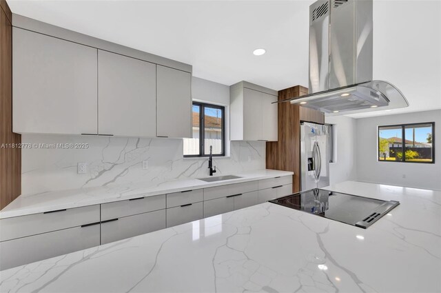 2411 NW 153rd St, Miami Gardens, FL 33054 - kitchen featuring a sink, modern cabinets, gray cabinetry, island exhaust hood, and stainless steel fridge