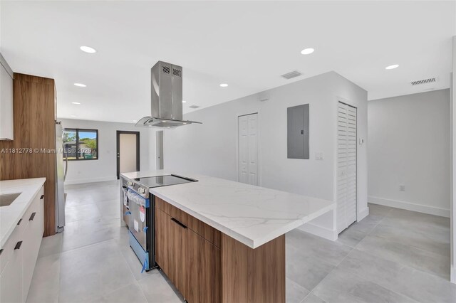 2411 NW 153rd St, Miami Gardens, FL 33054 - kitchen with stainless steel appliances, modern cabinets, island range hood, electric panel, and a large island