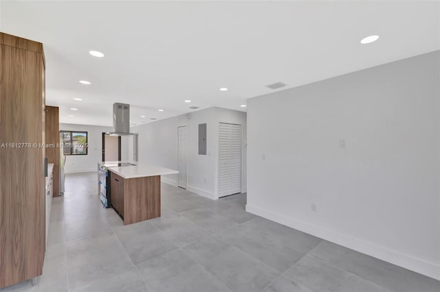2411 NW 153rd St, Miami Gardens, FL 33054 - kitchen with island range hood, modern cabinets, brown cabinetry, light countertops, and a kitchen island