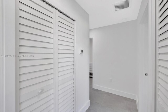 2411 NW 153rd St, Miami Gardens, FL 33054 - corridor featuring light tile patterned floors and baseboards