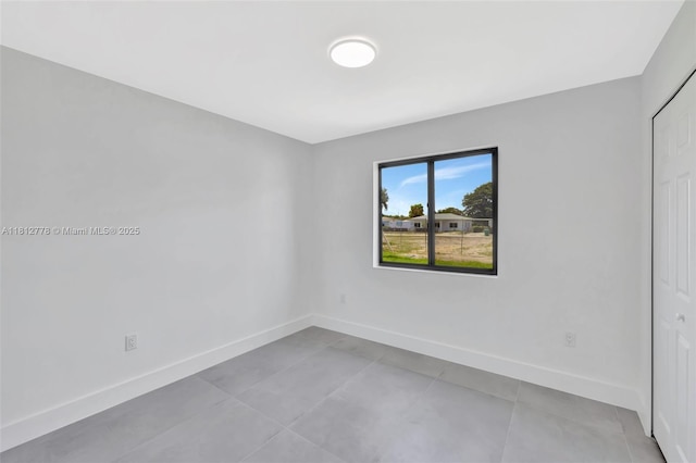 2411 NW 153rd St, Miami Gardens, FL 33054 - unfurnished bedroom featuring baseboards and tile patterned floors