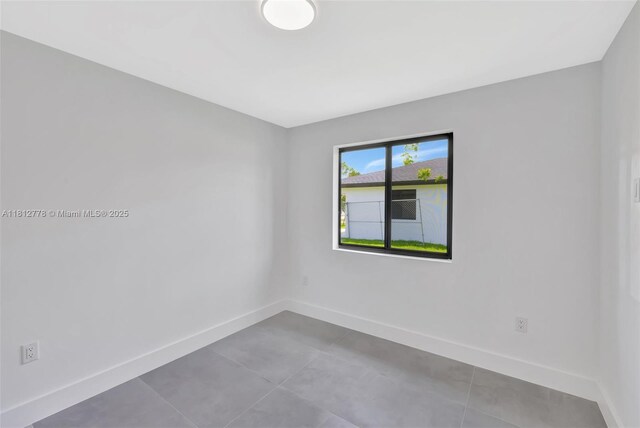 2411 NW 153rd St, Miami Gardens, FL 33054 - tiled spare room with baseboards