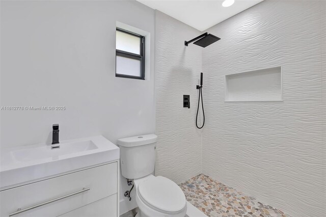 2411 NW 153rd St, Miami Gardens, FL 33054 - bathroom featuring tiled shower, toilet, and vanity