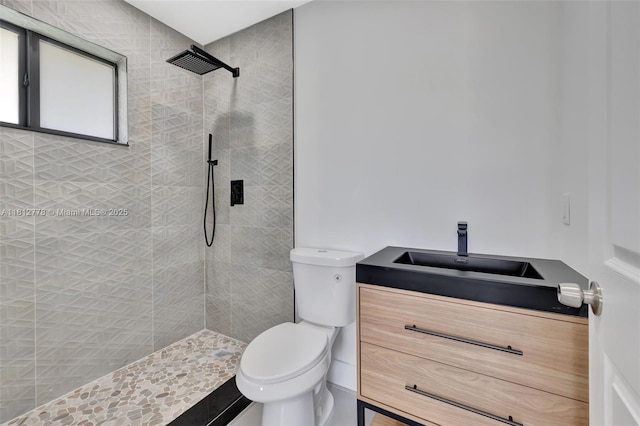 2411 NW 153rd St, Miami Gardens, FL 33054 - bathroom with toilet, a tile shower, and vanity