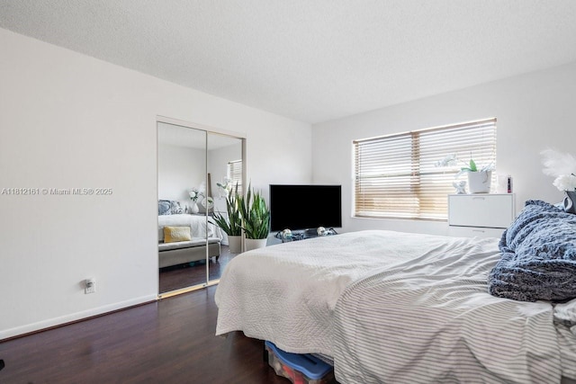 9235 SW 8th St Unit 502, Boca Raton, FL 33428 - bedroom with wood finished floors, a closet, and baseboards