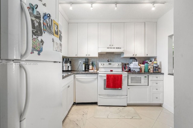 9235 SW 8th St Unit 502, Boca Raton, FL 33428 - kitchen with white appliances, under cabinet range hood, rail lighting, white cabinets, and tasteful backsplash