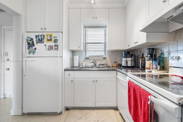 9235 SW 8th St Unit 502, Boca Raton, FL 33428 - kitchen featuring white appliances, under cabinet range hood, white cabinets, a sink, and tasteful backsplash