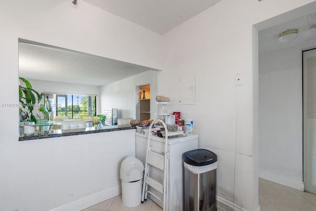 9235 SW 8th St Unit 502, Boca Raton, FL 33428 - bathroom featuring a textured ceiling, tile patterned floors, and baseboards