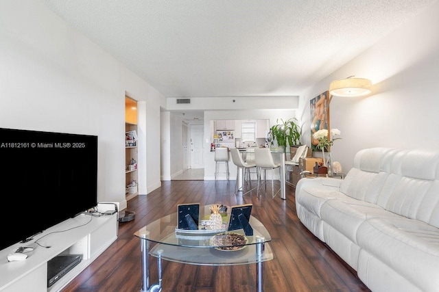 9235 SW 8th St Unit 502, Boca Raton, FL 33428 - living room featuring hardwood / wood-style flooring and a textured ceiling
