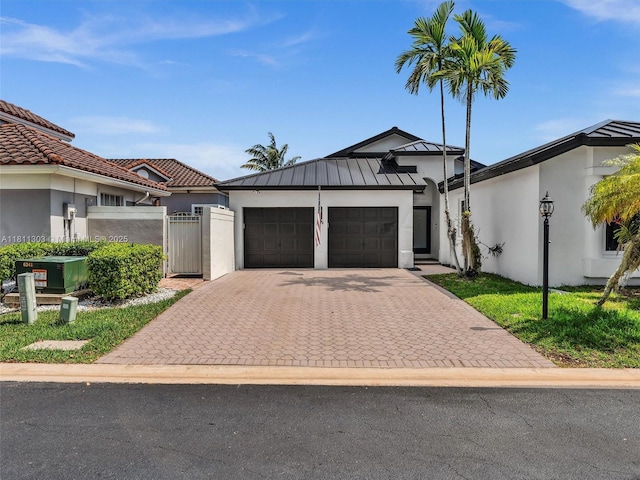13381 SW 151st Ter, Miami, FL 33186 - view of front of property featuring stucco siding, driveway, and an attached garage