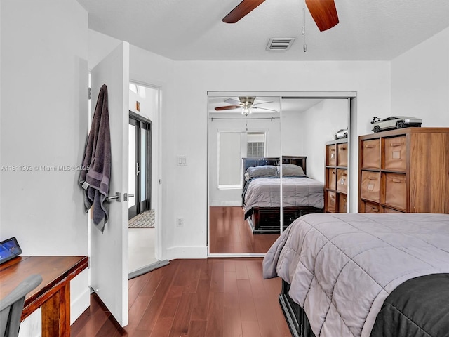 13381 SW 151st Ter, Miami, FL 33186 - bedroom with dark wood-style flooring, a closet, baseboards, and a ceiling fan