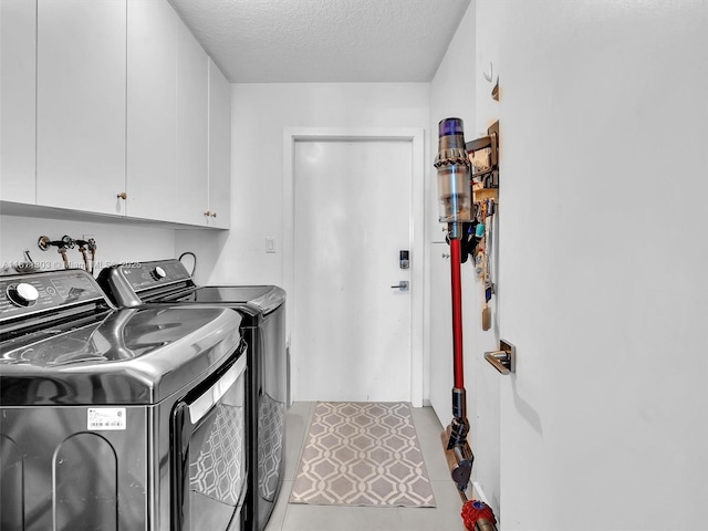 13381 SW 151st Ter, Miami, FL 33186 - laundry area featuring independent washer and dryer, cabinet space, and a textured ceiling