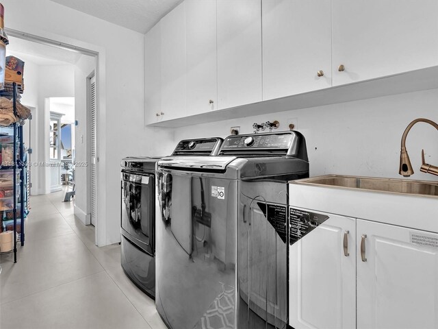 13381 SW 151st Ter, Miami, FL 33186 - laundry area featuring cabinet space and washing machine and dryer