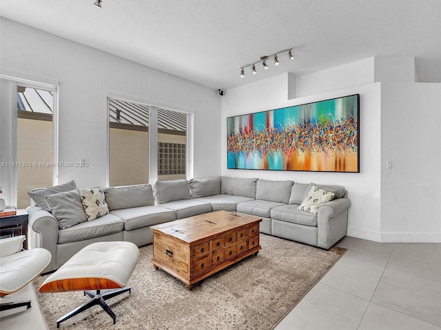 13381 SW 151st Ter, Miami, FL 33186 - tiled living area with track lighting, baseboards, and a textured ceiling