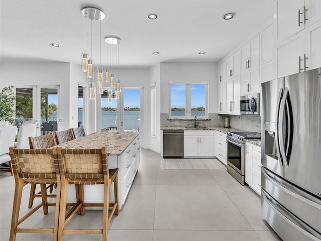 13381 SW 151st Ter, Miami, FL 33186 - kitchen featuring stainless steel appliances, a sink, healthy amount of natural light, light stone counters, and recessed lighting