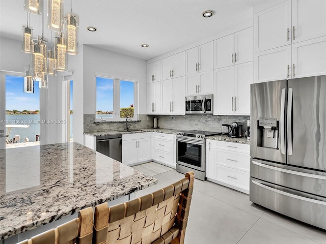 13381 SW 151st Ter, Miami, FL 33186 - kitchen featuring stainless steel appliances, a sink, tasteful backsplash, white cabinetry, and recessed lighting
