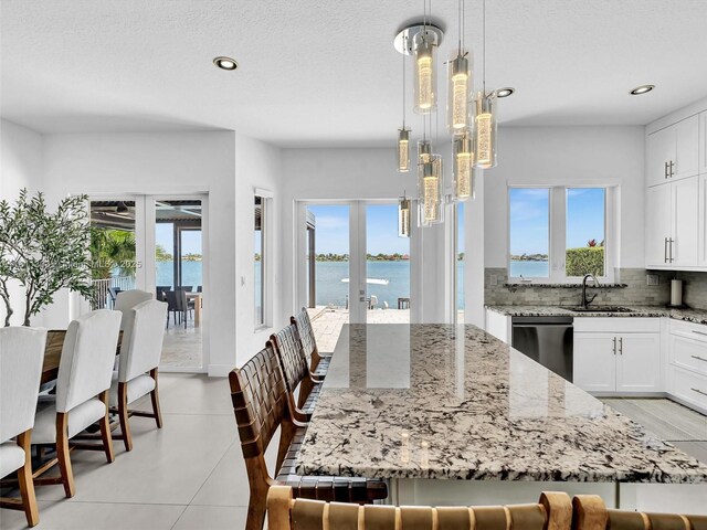 13381 SW 151st Ter, Miami, FL 33186 - kitchen featuring dishwasher, a sink, light stone countertops, recessed lighting, and tasteful backsplash