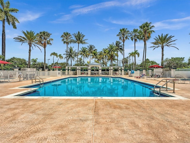 13381 SW 151st Ter, Miami, FL 33186 - community pool featuring a patio area