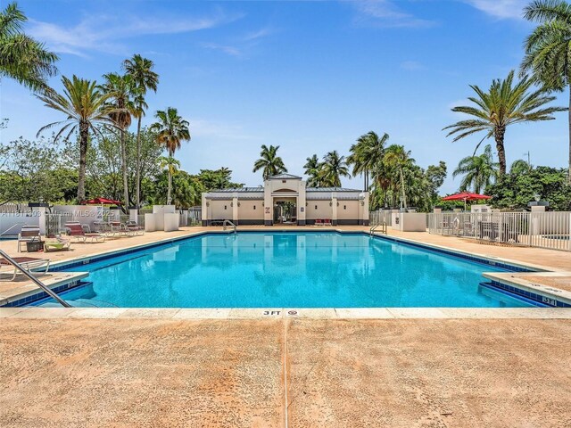 13381 SW 151st Ter, Miami, FL 33186 - community pool featuring a patio area