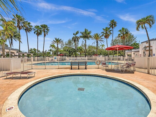 13381 SW 151st Ter, Miami, FL 33186 - community pool with a patio area