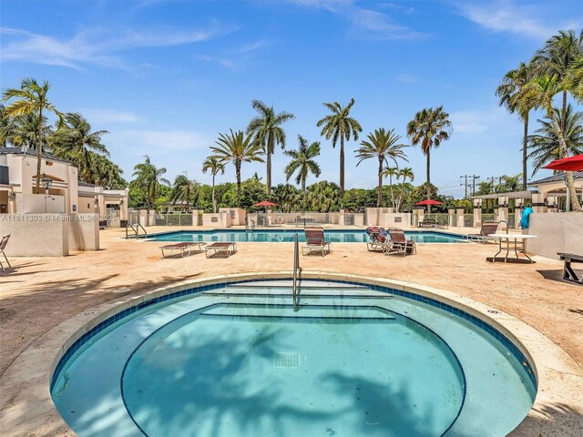 13381 SW 151st Ter, Miami, FL 33186 - community pool featuring a hot tub and a patio area
