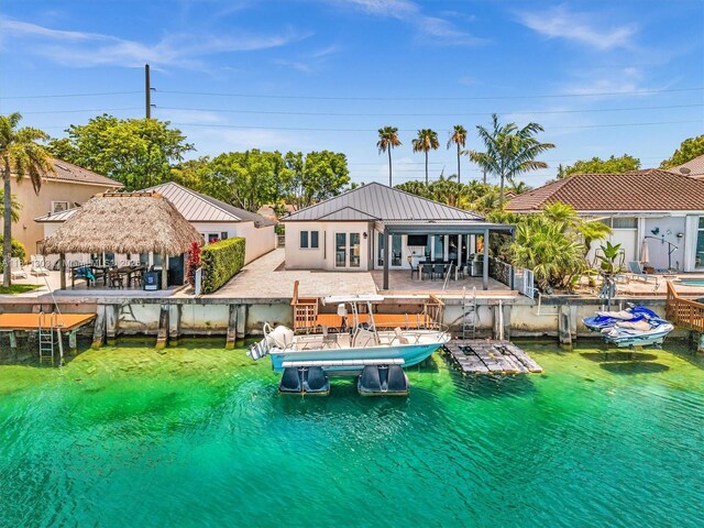 13381 SW 151st Ter, Miami, FL 33186 - back of property with boat lift, metal roof, a water view, a patio, and a gazebo