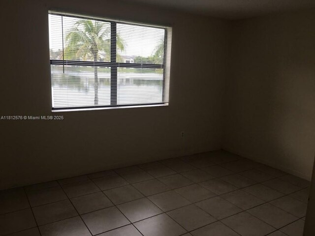 1061 Jefferson Dr Unit 1061B, Homestead, FL 33034 - tiled empty room with plenty of natural light