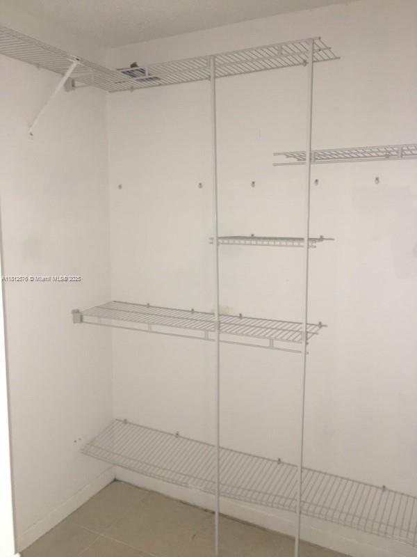1061 Jefferson Dr Unit 1061B, Homestead, FL 33034 - walk in closet featuring light tile patterned floors