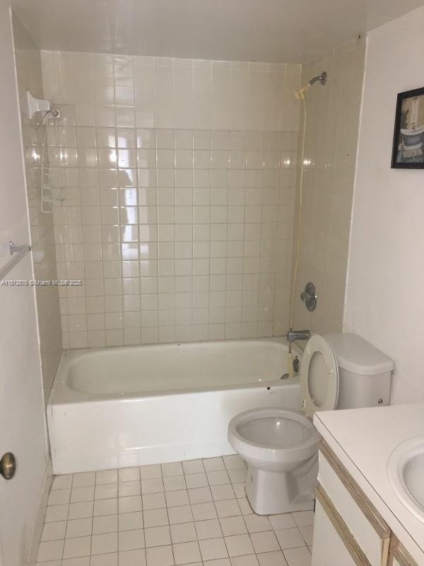 1061 Jefferson Dr Unit 1061B, Homestead, FL 33034 - bathroom featuring tile patterned floors, shower / bathtub combination, vanity, and toilet