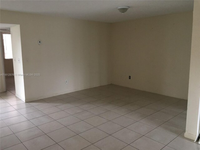 1061 Jefferson Dr Unit 1061B, Homestead, FL 33034 - empty room with light tile patterned flooring