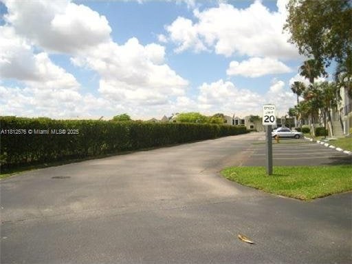 1061 Jefferson Dr Unit 1061B, Homestead, FL 33034 - view of asphalt street with traffic signs