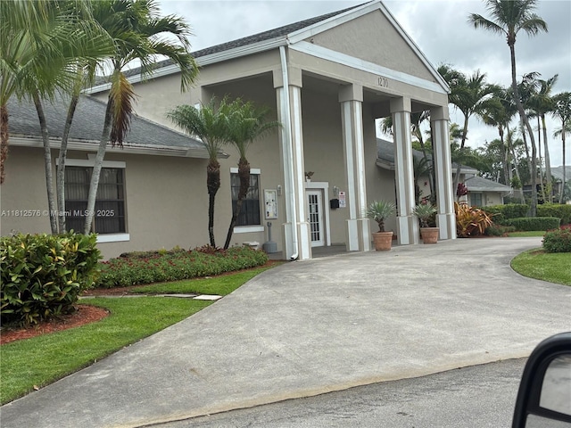 1061 Jefferson Dr Unit 1061B, Homestead, FL 33034 - view of front facade with stucco siding and a shingled roof