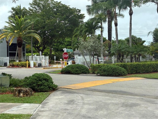 1061 Jefferson Dr Unit 1061B, Homestead, FL 33034 - view of asphalt road featuring traffic signs