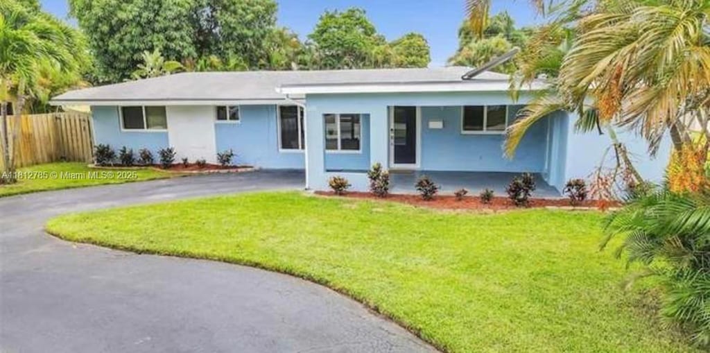 1601 SW 2nd Ave, Pompano Beach, FL 33060 - ranch-style home featuring driveway, stucco siding, and a porch