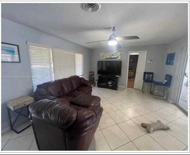 1601 SW 2nd Ave, Pompano Beach, FL 33060 - living area with a ceiling fan, light tile patterned floors, and a textured ceiling