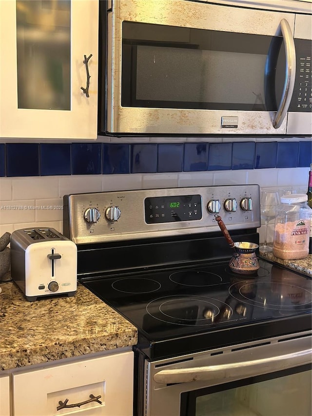 1130 11th St Unit 6H, Miami Beach, FL 33139 - kitchen view of stainless steel appliances and tasteful backsplash